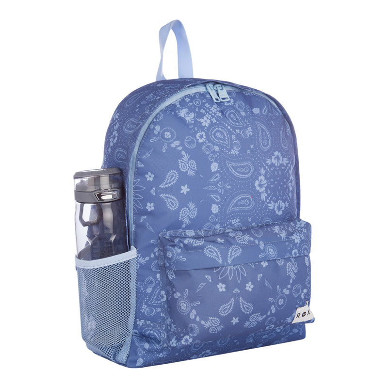 The Roxy Sugar Baby Bottle Backpack features a blue paisley pattern, a front pocket, and a side mesh pocket holding a water bottle. It includes a light blue zipper and a convenient carry handle on top.
