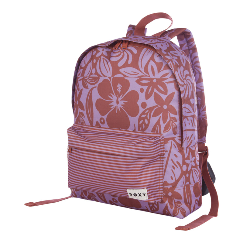 The Roxy Sugar Baby Bottle Backpack is a purple and pink floral-patterned backpack with a striped front pocket, featuring the Roxy label, adjustable shoulder straps, and a top handle.
