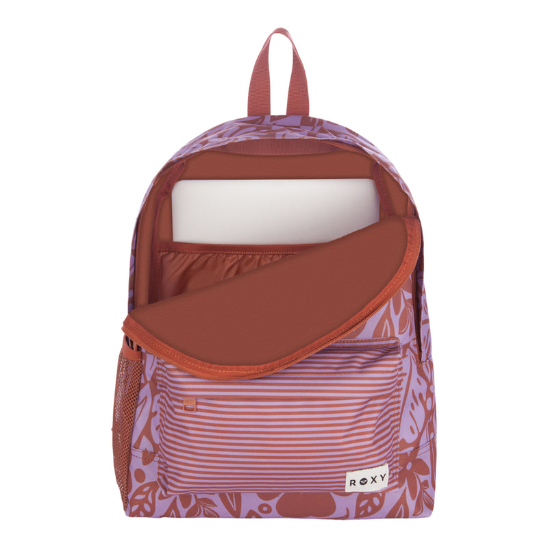 The Roxy Sugar Baby Bottle Backpack is shown open, featuring a purple and rust-colored floral and striped design. It includes a padded laptop sleeve, a front zipper pocket, a top handle, and ROXY branding on the front.