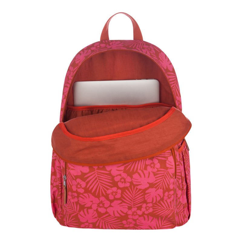 The Roxy Moon Magic Backpack features a pink and red floral pattern, with its front pocket unzipped and a laptop partially visible in the main compartment.