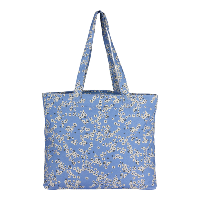 The Sweeter Than Honey Tote Bag by ROXY is crafted from recycled cotton and features a light blue color adorned with a charming small white floral pattern. This eco-friendly tote offers two sturdy handles for convenient carrying.