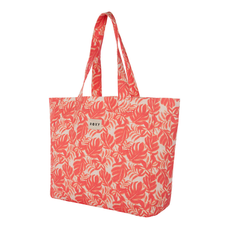 The Roxy Anti Bad Vibes Tote Bag in coral and white features a stylish leaf pattern and two sturdy handles. Made from recycled cotton, this eye-catching tote bag is finished with a small rectangular ROXY logo tag on the front.