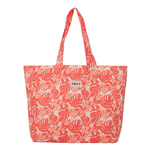 Coral Palm Haze Roxy Anti Bad Vibes Tote Bag featuring a leafy tropical pattern, two shoulder straps, and a small rectangular Roxy label on the front center. This stylish tote bag is crafted from recycled cotton for an eco-friendly touch.