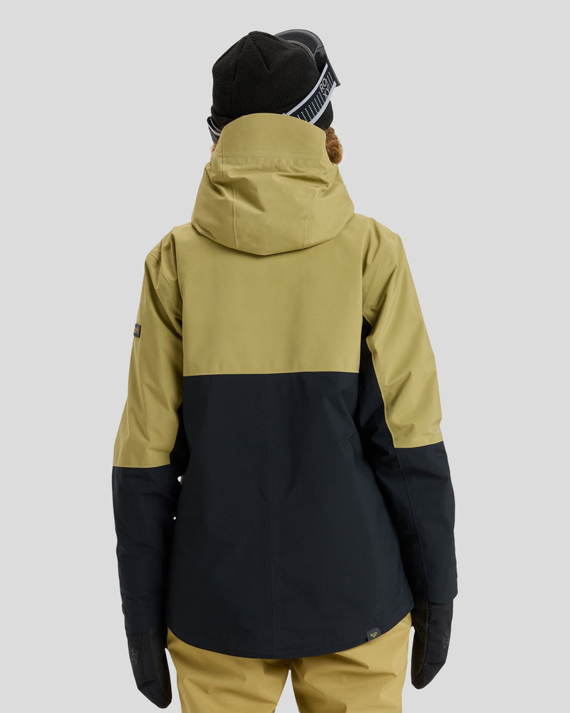 A person, seen from behind against a plain gray background, wears the Roxy Gore-Tex Stretch Purelines Jacket in yellow and dark gray paired with matching pants, along with a black beanie and gloves.