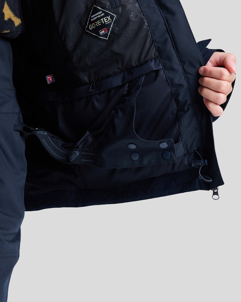 A person holds open a black Roxy Gore-Tex Stormday Jacket for women, revealing the interior details including pockets, buttons, PrimaLoft insulation, and an inner strap.