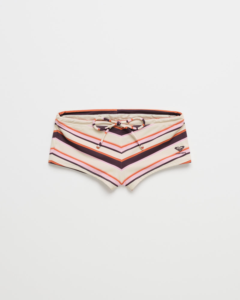 The ROXY x Madhappy Swim Short Cheeky Bikini Bottom features a drawstring waist and playful horizontal stripes in shades of pink, purple, and cream, finished with a small heart-shaped logo on the left. Inspired by the vibrant spirit of the Roxy x Madhappy collection, these bikini bottoms are shown against a plain white background.