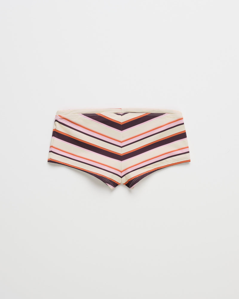 ROXY x Madhappy Swim Short Cheeky Bikini Bottom featuring horizontal and diagonal stripes in beige, white, red, and dark brown, laid flat on a white background.