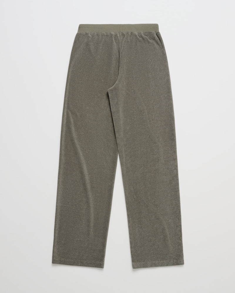 A pair of ROXY x Madhappy Terry Lounge Pant in straight-leg, olive green, featuring an elastic waist and crafted from a soft, velvety fabric is laid flat on a white background.
