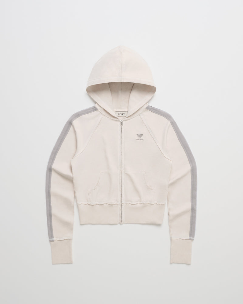 The ROXY x Madhappy French Terry Shrunken Full Zip Jacket in Birch, a limited-edition piece crafted from soft French terry, features gray stripes along the sleeves, front pouch pockets, and a small embroidered logo on the left chest. Laid flat on a white background.
