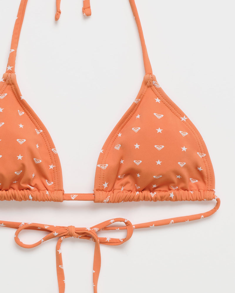 The Roxy x Madhappy Mini Tiki Triangle Bikini Top by Roxy is shown in the Apricot Spice colorway, featuring a white star pattern and small Madhappy X Roxy logos, with adjustable neck and back ties, displayed on a white background.