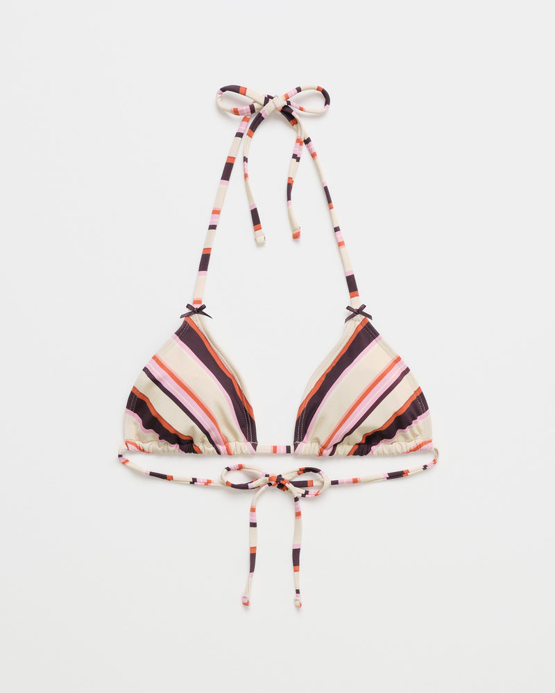 The Roxy x Madhappy Mini Tiki Triangle Bikini Top is a women's multicolor stripe bikini top featuring thin straps that tie at the neck and back; this design displays white, pink, red, and black stripes on a plain white background.