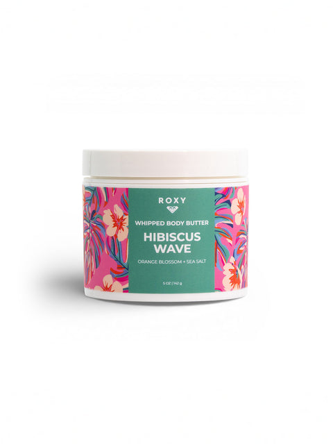 Roxy Hibiscus Wave Body Butter, featuring a colorful floral design with orange blossom and sea salt details, provides after-shower moisture for dry skin relief. The jar is set against a plain white background.