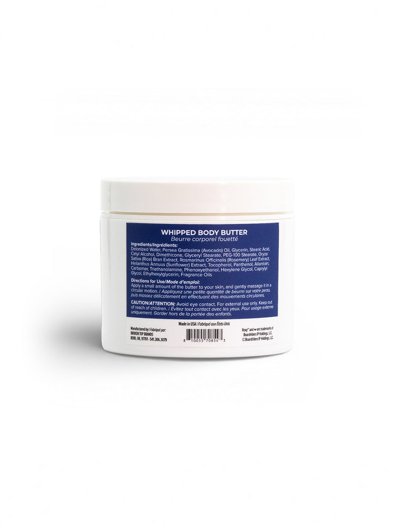 Roxy Deep Dive Body Butter comes in a white plastic jar with a blue label listing product info, ingredients, and usage instructions in white text. Infused with marine notes for deep hydration, the jar is shown against a plain white background.