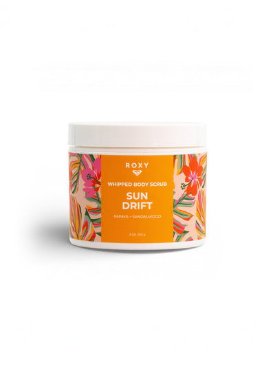 The Roxy Sun Drift Body Scrub comes in a round container with an orange label and vibrant tropical designs, featuring papaya and sandalwood—perfect for exfoliating and self-care.