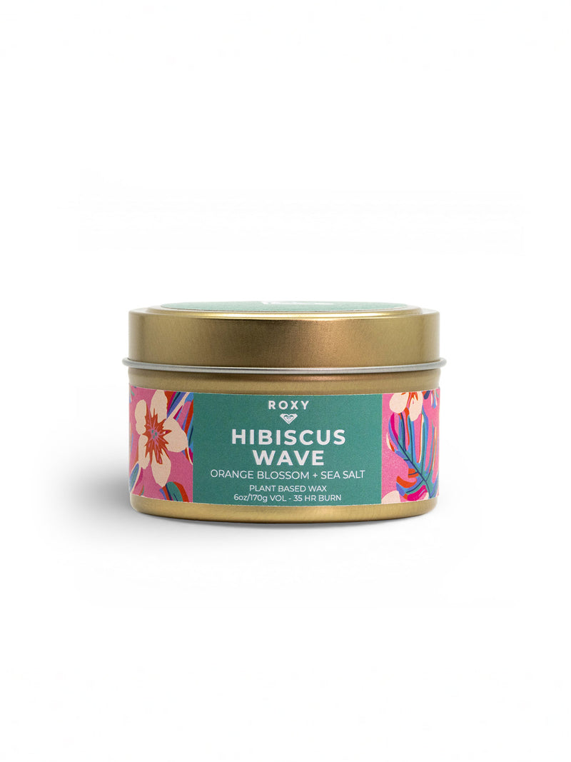 Roxy’s Hibiscus Wave Palm Tin Candle features a tropical orange blossom and sea salt scent, colorful floral label art, and comes in a decorative tin.