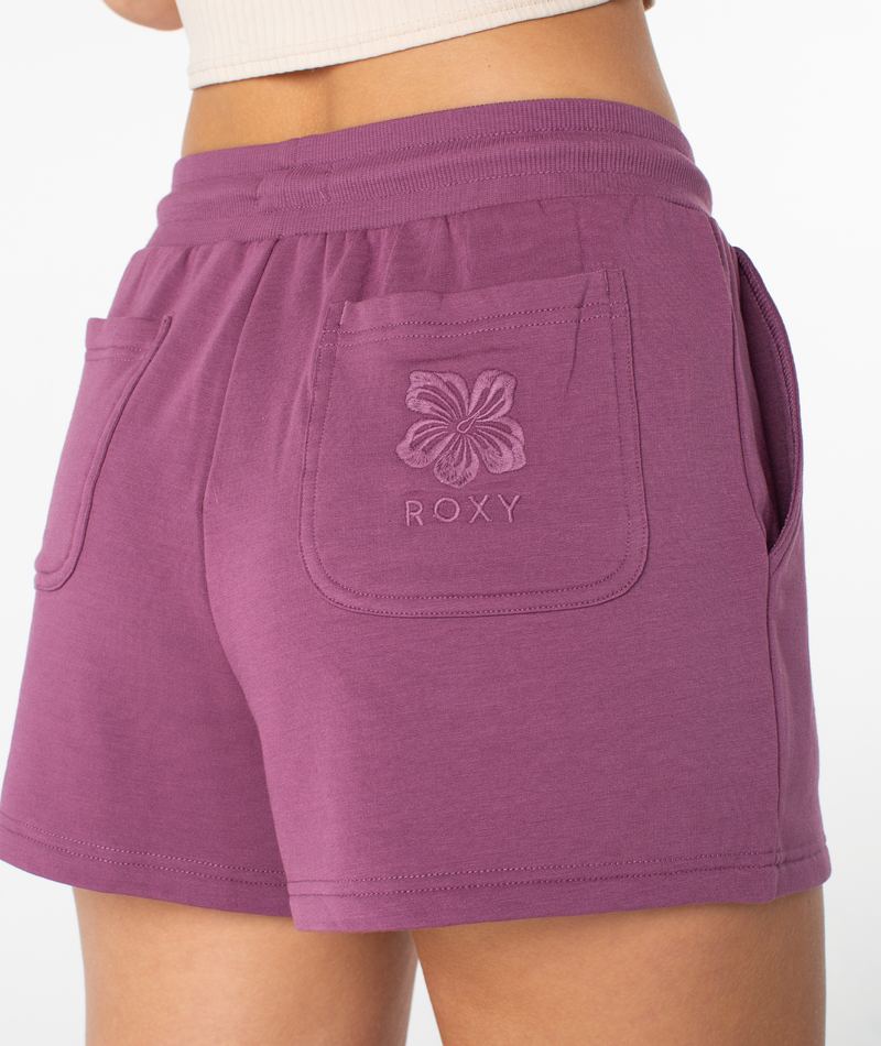 Plum-colored Roxy Surfing By Moonlight shorts made of modal stretch fabric, featuring an elastic waistband and a back pocket with an embroidered floral logo.