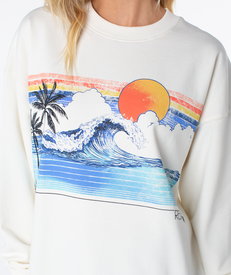 Off-white Roxy Line Up Crew Top featuring a graphic of a crashing wave, palm trees, and a sun set against colorful horizontal stripes for coastal comfort.