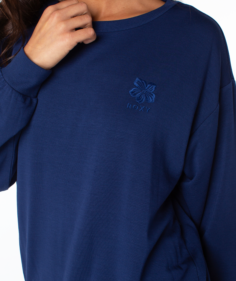 Navy blue Roxy Surfing By Moonlight Top crewneck sweatshirt featuring an embroidered flower and text logo on the chest.