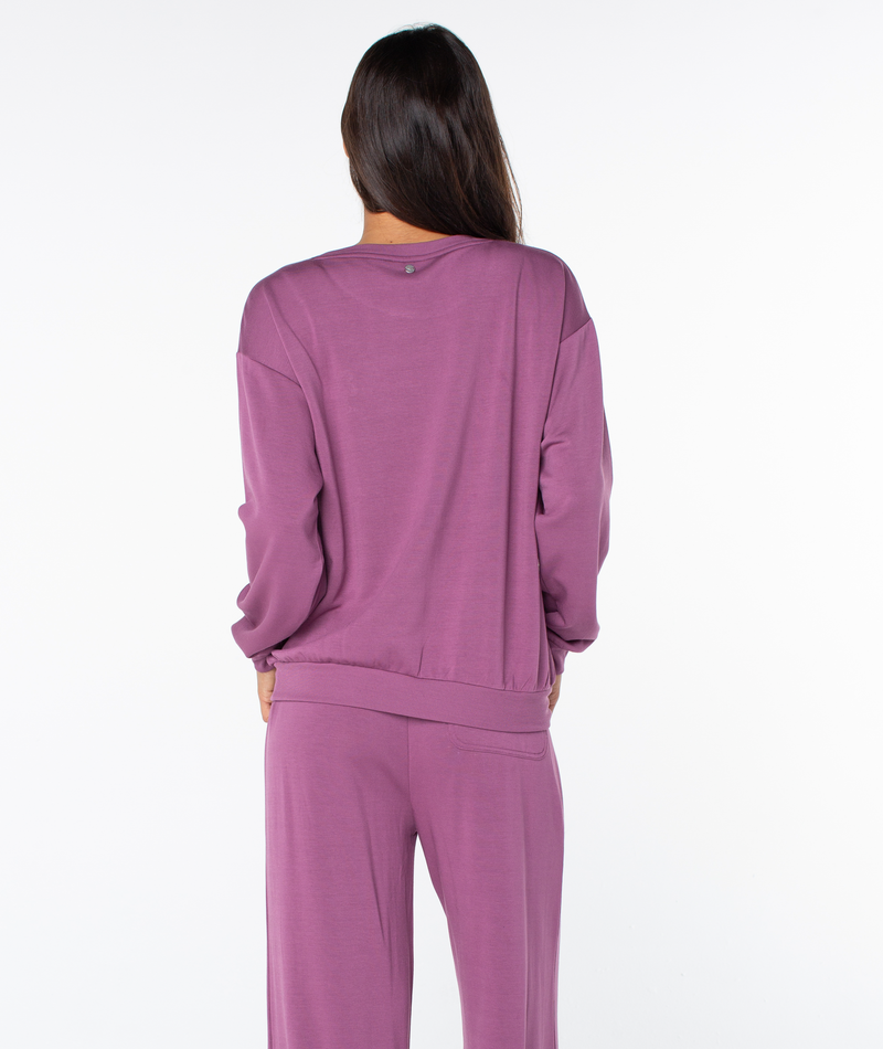 Back view of a person wearing a Roxy Surfing By Moonlight Top and matching lounge pants.