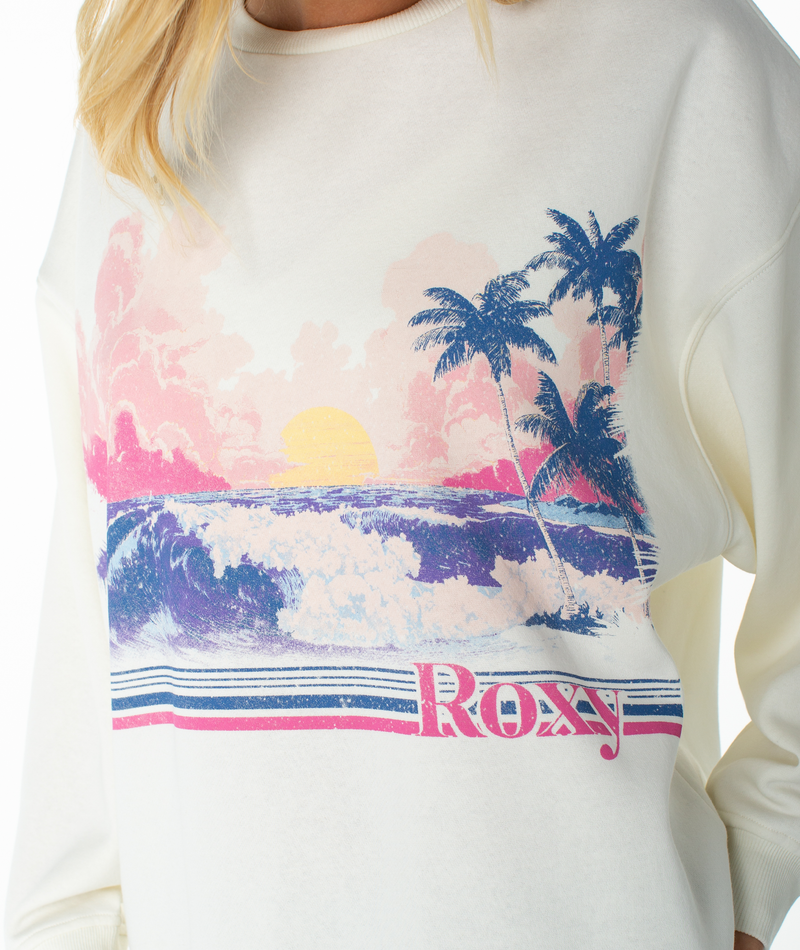 Off-white Roxy Morning Stroll Top featuring a colorful beach scene graphic with palm trees, a sunset, and waves, with the brand name printed at the bottom.