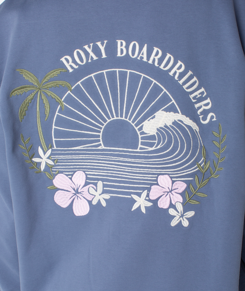 Blue cotton blend fabric with embroidered ROXY BOARDRIDERS, sunset over waves, palm tree, green leaves, and pink and white flowers for a casual style. Product: Line Up Zip by Roxy.