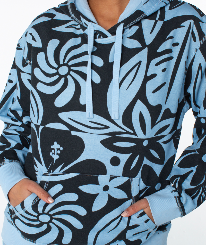 Roxy Maile Printed Hoodie in oversized light blue with a black floral print, featuring a drawstring hood and a front kangaroo pocket.