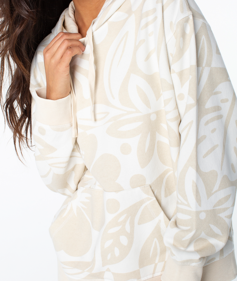 Roxy Maile Printed Hoodie in cream, featuring an oversized fit, beige tropical leaf print, front kangaroo pocket, and beachy graphics.
