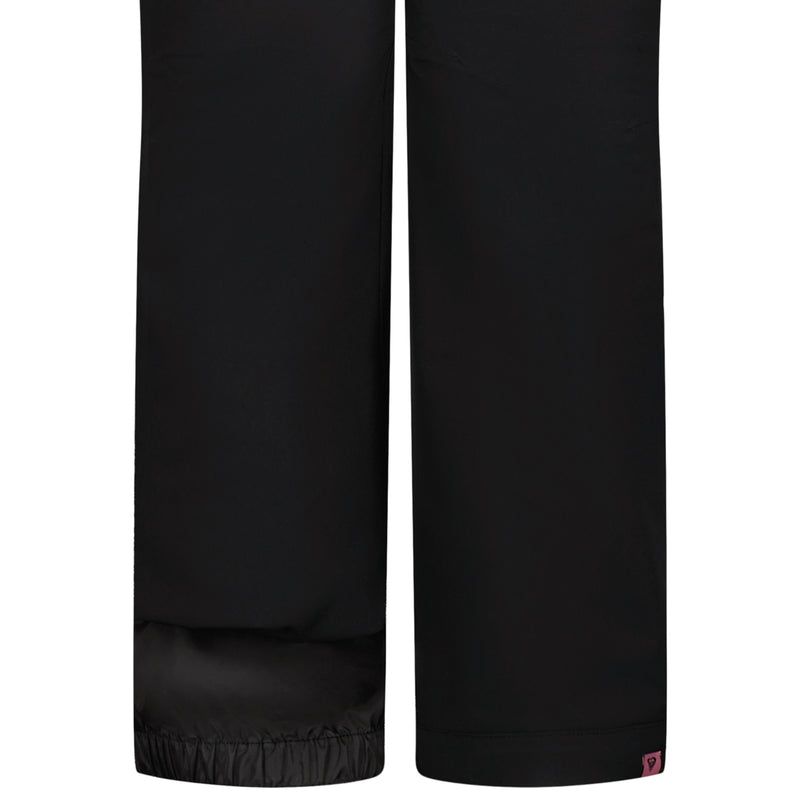 Close-up of the Roxy Girls' Backyard Pant in black, showing straight legs, an adjustable waistband, an elastic cuff on the left leg, and a plain hem with a small pink tag on the right.