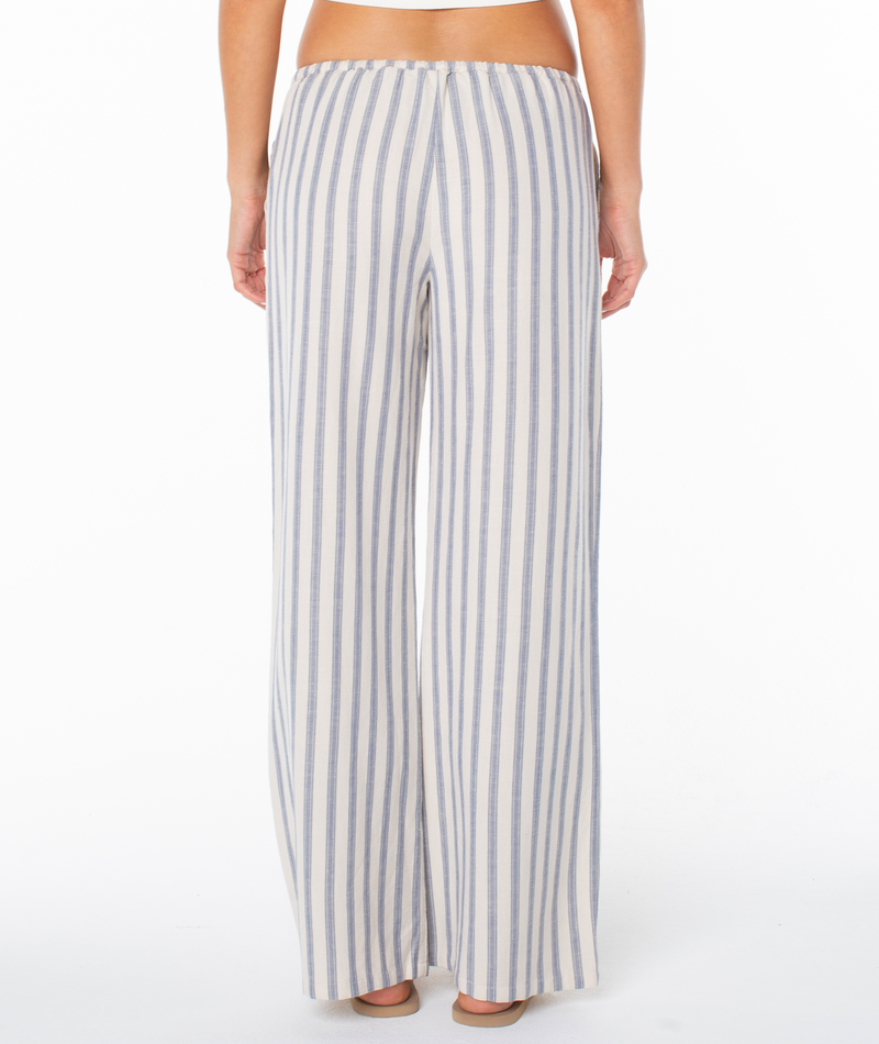 Back view of the Roxy Iyla Pant 2, blue and white striped, relaxed fit coastal pants featuring a wide-leg silhouette and an elastic waistband.