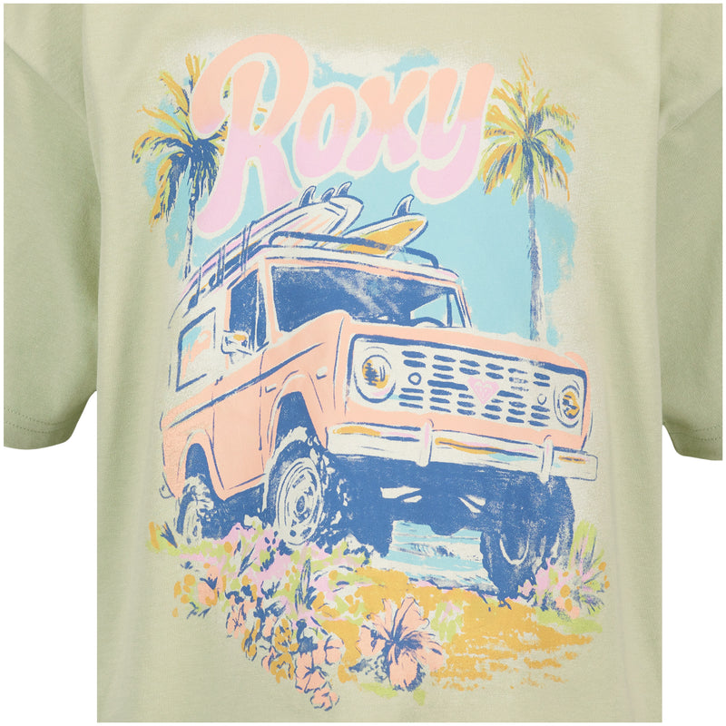 The Girls' Coastal Oversized Tee by Roxy features a pastel ROXY graphic on light green cotton, with a pink vintage SUV, surfboards, palm trees, flowers, and "Roxy" in large script above the scene.