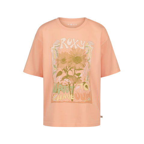The Girls' Sunshine Oversized Tee by Roxy is a peach-colored cotton jersey shirt with two sunflowers and wavy "ROXY" and "Want to Have Sun" graphics on the front, featuring a relaxed, short-sleeve fit.
