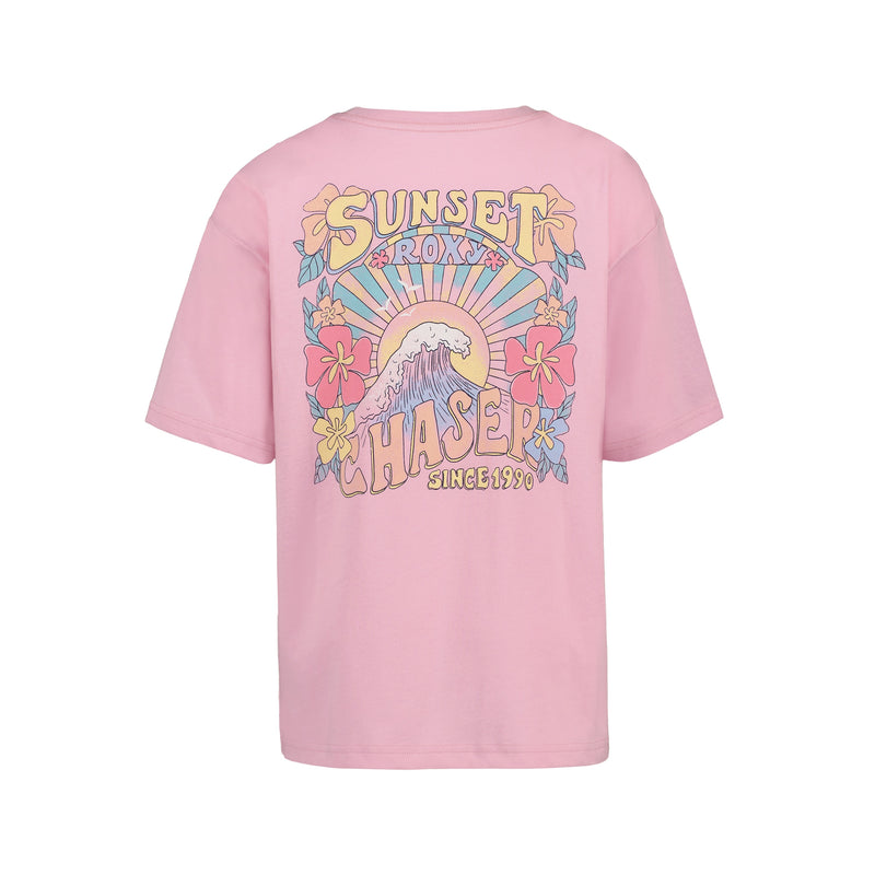 The Girls' Sun Chaser Oversized Tee by Roxy is a pink cotton jersey featuring bold back graphics—a wave, hibiscus flowers, and rising sun with “Sunset Chaser Roxy Since 1990” in stylized letters.