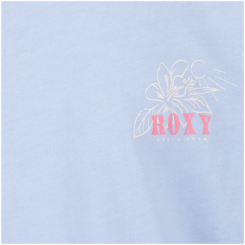 The Girls' Coastal Journey Long Sleeve Tee by Roxy features a light blue color, relaxed fit, outlined flower and sun graphic, and bold pink "ROXY" lettering above "since 1990," perfect for an effortless coastal look.