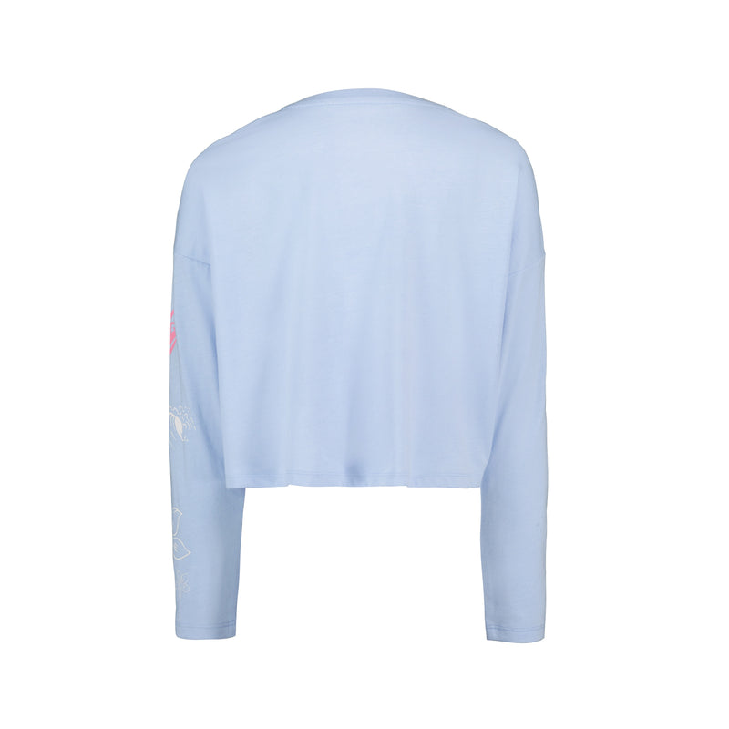 The Roxy Girls' Coastal Journey Long Sleeve Tee, shown from the back in light blue, features a relaxed fit with minimal visible design and straight sleeves for an easy coastal look.