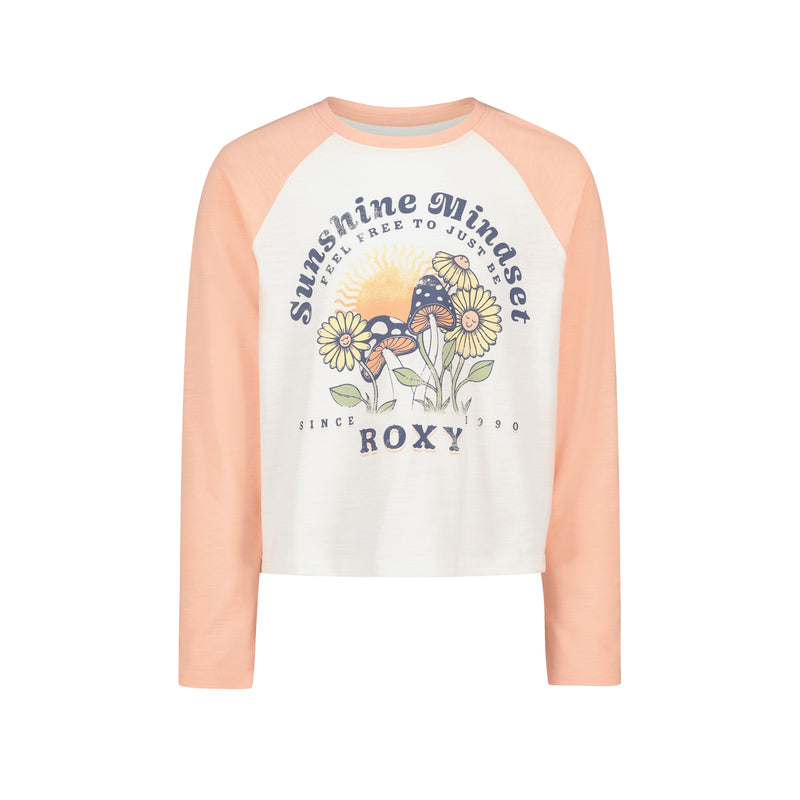 The Girls’ Sunshine Mindset Long Sleeve Tee by Roxy features a white and peach raglan design with playful sunflower, sunglasses, and sun graphics. The front displays text that reads “Sunshine Mindset,” “Feel Free to Just Be,” “Since 1990,” and “ROXY.” Crafted in a relaxed fit, this top offers all-day comfort and effortless style.