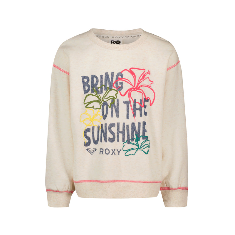 The Roxy Girls' Sunshine Crew is a cream oversized sweatshirt with “BRING ON THE SUNSHINE” text, colorful floral graphics in pink, yellow, and green, and pink stitching—perfect as a beach pullover.