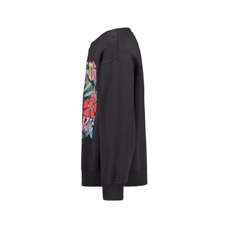 Side view of the Roxy Girls' Sunny Crew, an oversized black cotton-poly fleece pullover with colorful graffiti-style floral artwork on the front and sleeve, set against a plain white background.