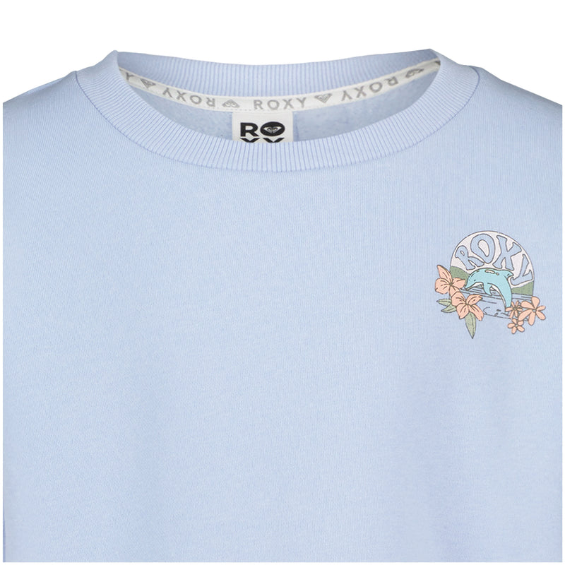 The Girls’ Ocean Explorer Crew by Roxy is a light blue oversized fleece sweatshirt featuring the ROXY logo, a wave, and orange flowers printed on the upper left chest. This girls’ crew neck pullover also has a repeating ROXY pattern along the inside neckline tape for added style.