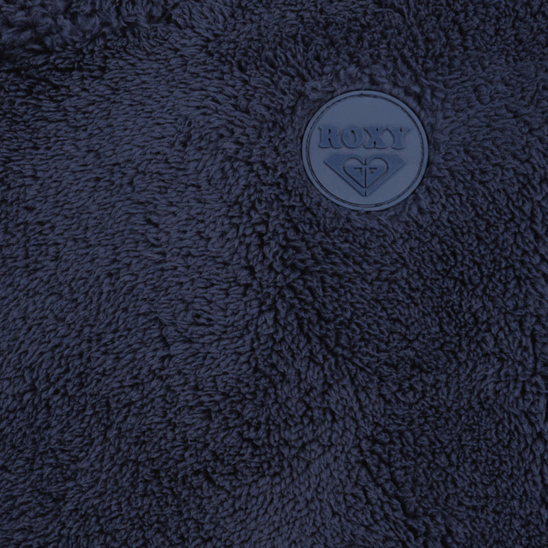 Close-up of a navy blue fuzzy fleece Girls’ Minky Hoodie featuring a circular Roxy branded patch.