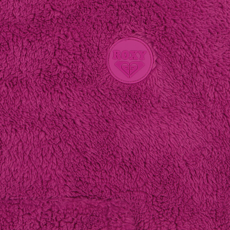 Close-up of a bright magenta Roxy Girls’ Minky Hoodie featuring plush fleece and a circular branded patch.