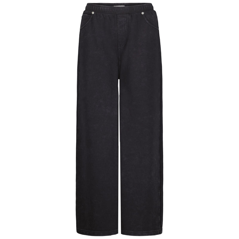 The Roxy Girls' Jump Start Jogger features wide legs, soft cotton fleece, an elastic waist, and front pockets, shown against a white background.