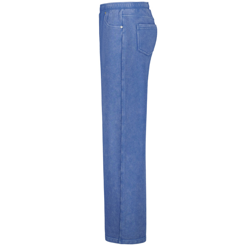 Side view of the Girls' Jump Start Jogger by Roxy, featuring blue denim wide legs, elastic waistband, front and back pockets, and soft cotton-poly fleece fabric, displayed against a white background.