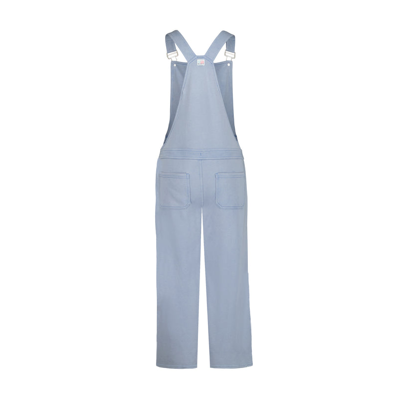 Roxy Girls' Coastline Overall in light blue, made from soft cotton-poly French terry, features adjustable straps, front chest bib, and two back pockets. Shown from the back on a white background.