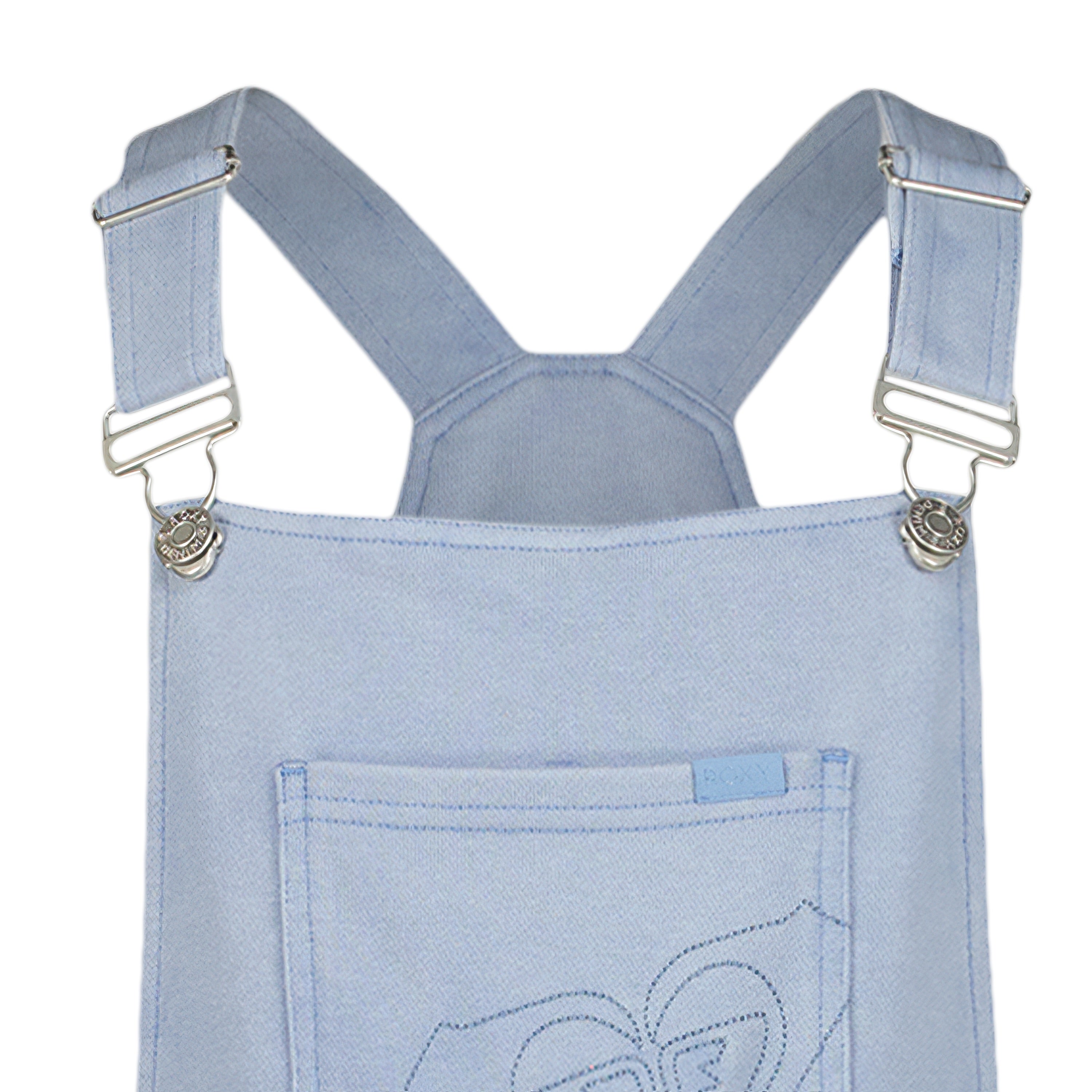 Close-up of the Girls' Coastline Overall by Roxy, featuring adjustable metal buckle straps, a front chest pocket, and light blue denim with visible stitching on soft cotton-poly French terry fabric.