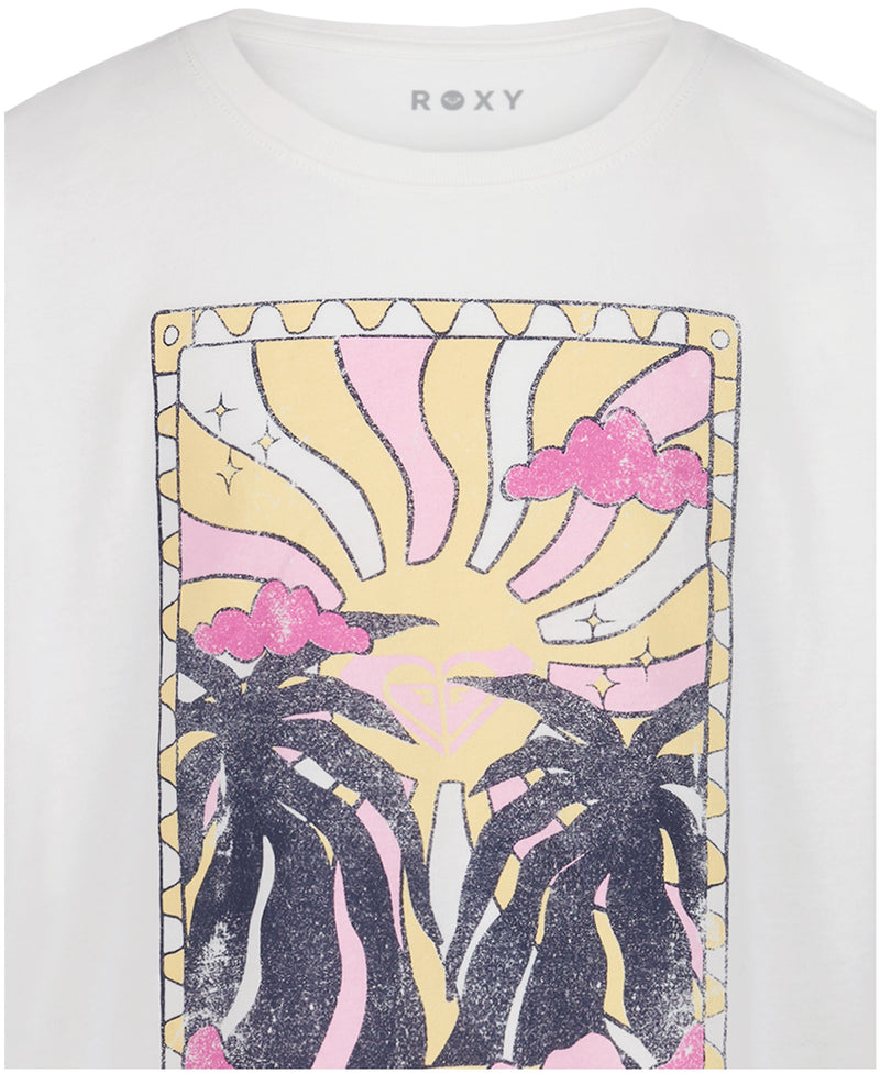 The Girls' Sun-Kissed Oversized Tee by Roxy features soft cotton jersey, a white base with two black palm trees, pink clouds, and a pastel yellow sun with the Roxy logo centered in the sun.