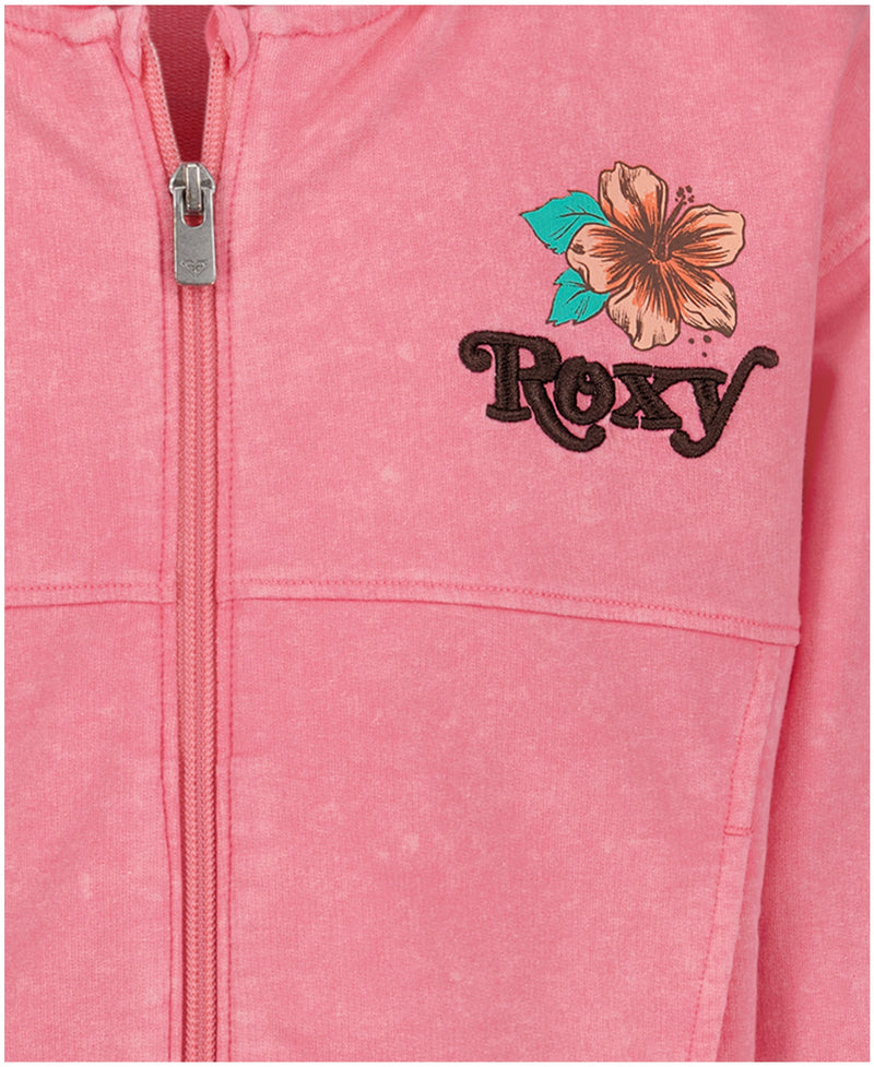 Close-up of the Girls' Sunset Oversized Hoodie by Roxy in pink, featuring hibiscus and green leaf embroidery above “Roxy” in black on the left chest—a cozy, beach-ready oversized hoodie.