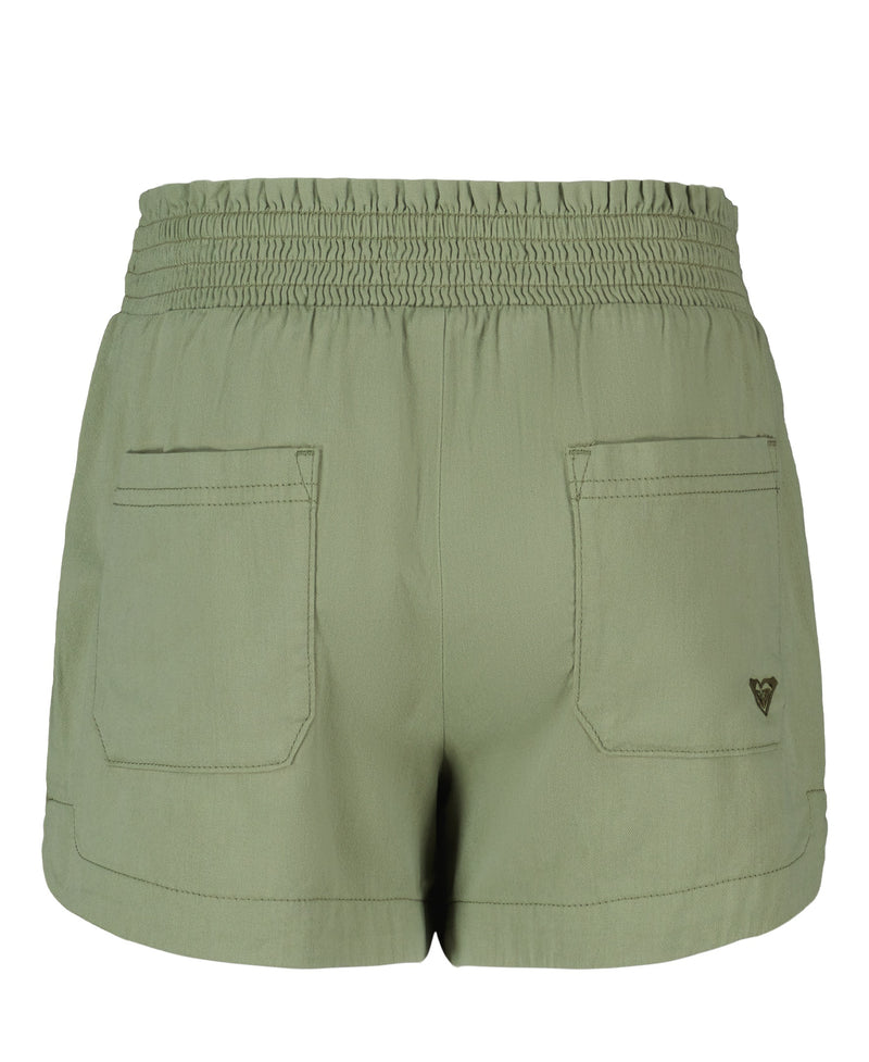 The Roxy Girls' Soleil Short features light green brushed twill, a smocked elastic waistband, two back pockets, and a small metal heart logo on the right pocket.