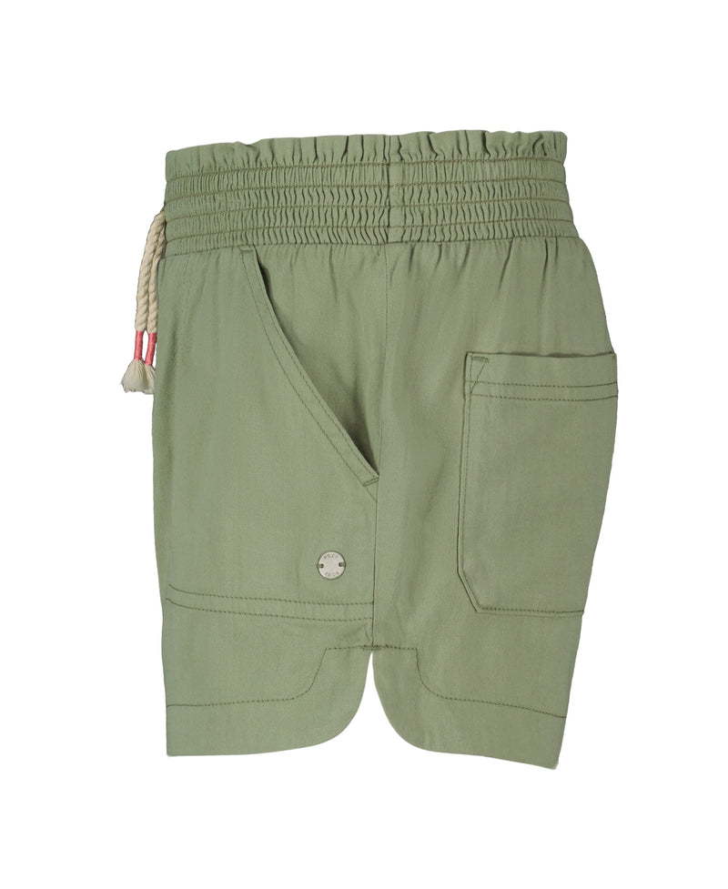 The Girls' Soleil Short by Roxy features light green brushed twill, a smocked elastic waistband with a red and white drawstring, large front pocket with button accent, and a back pocket, shown on a white background.