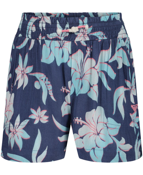 The Girls' Hula Soleil Short by Roxy features a navy blue design with an elastic waistband, white drawstring, and a light blue and pink tropical floral pattern—perfect shorts for your next beach adventure.