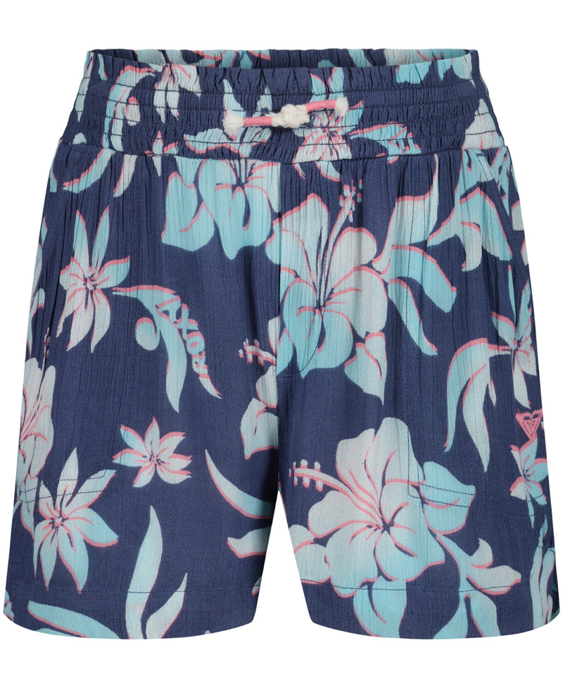 The Girls' Hula Soleil Short by Roxy features a navy blue design with an elastic waistband, white drawstring, and a light blue and pink tropical floral pattern—perfect shorts for your next beach adventure.